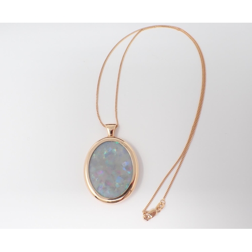 146 - An Opal Pendant set oval slice of opal, 31.80ct, in rose gold frame on fine chain in 18ct gold