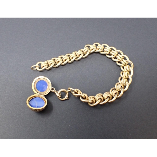 148 - A 9ct gold fancy link Bracelet with spherical locket fob, approx 44.90gms all in