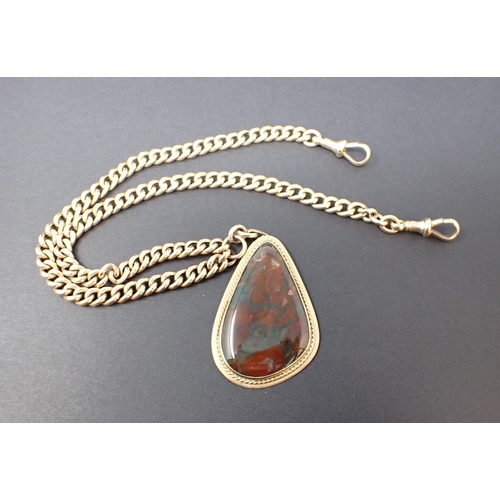 150 - A Moss Agate Pendant the drop shaped stone in 9ct gold surround suspended from a 9ct gold graduated ... 