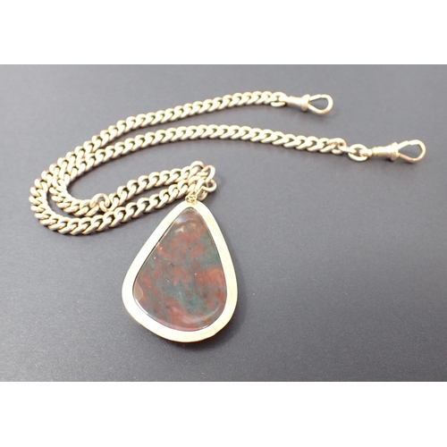 150 - A Moss Agate Pendant the drop shaped stone in 9ct gold surround suspended from a 9ct gold graduated ... 