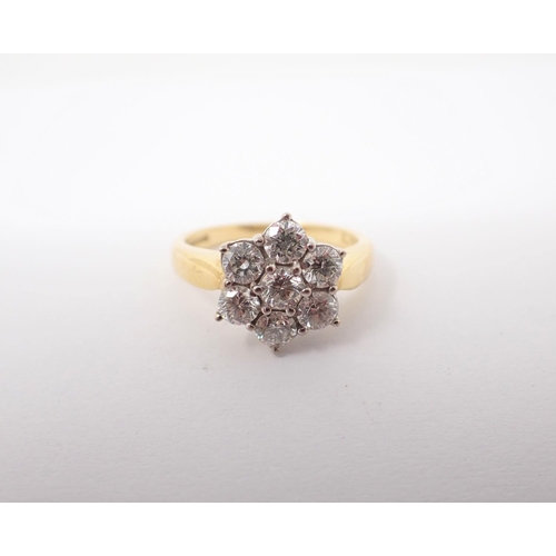 155 - A Diamond Daisy Cluster Ring claw-set seven brilliant-cut stones, total diamond weight 0.71cts, in 1... 