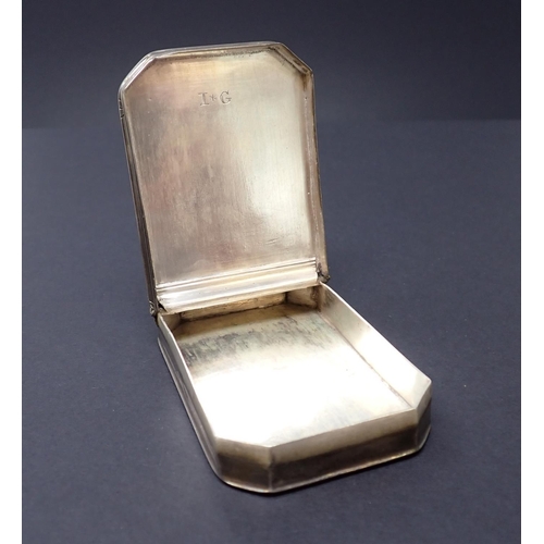 188 - An antique silver Snuff Box with hinged lid, scroll engraved decoration and presentation inscription... 