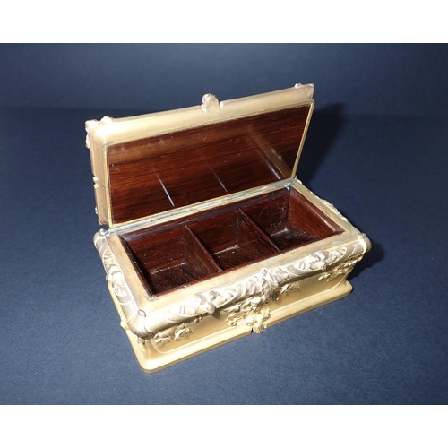 190 - An ormolu and rosewood Stamp Box of sarcophagus form, having hinged lid, embossed foliate decoration... 