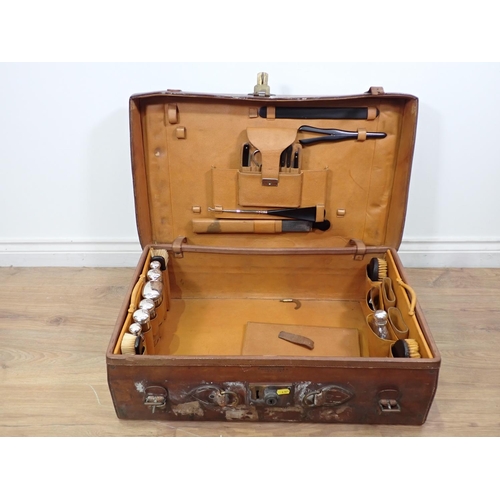 2 - A Gentleman's leather Travelling Case with silver topped glass bottles