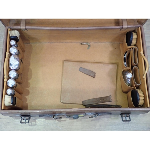 2 - A Gentleman's leather Travelling Case with silver topped glass bottles