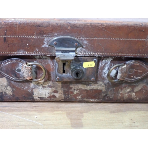 2 - A Gentleman's leather Travelling Case with silver topped glass bottles