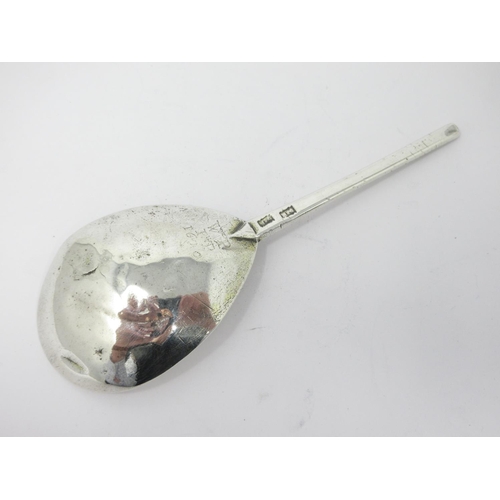 25 - A 17th Century silver Spoon with leafage engraved pear shape bowl, the reverse with initials and dat... 