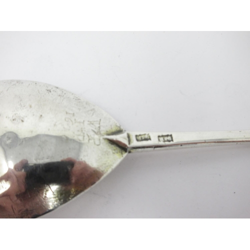 25 - A 17th Century silver Spoon with leafage engraved pear shape bowl, the reverse with initials and dat... 