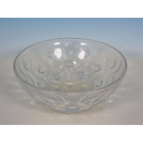 252 - An R Lalique circular Bowl with tear drop moulded design, marked R LALIQUE. FRANCE 8 in Diam