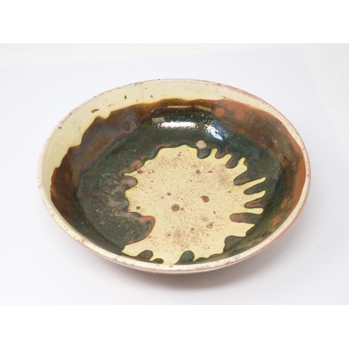 256 - An antique slipware pottery Bowl with green and yellow glaze 9 3/4in D and a pottery Bowl with paint... 