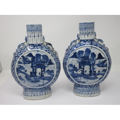 272 - A pair of Chinese blue and white Moon Flasks with designs of figures in landscapes, 10 1/2 in H, one... 