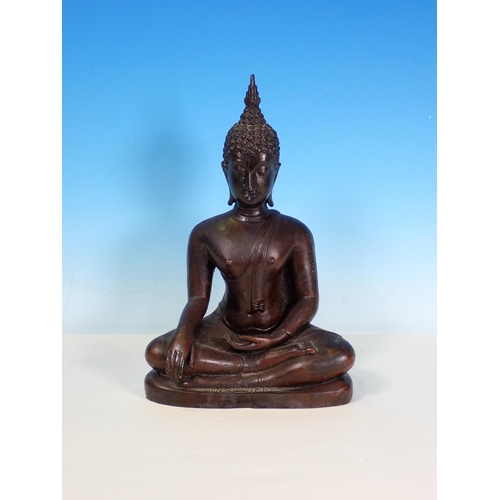 279 - An Eastern bronze Figure of a seated Buddha, 11 1/2in H