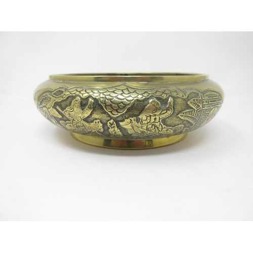 281 - A Chinese bronze Bowl with reserves of figures on horseback, etc, roundel of reign marks, etc, to un... 