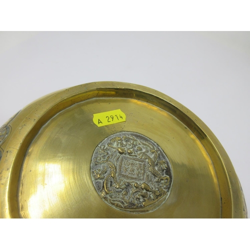 281 - A Chinese bronze Bowl with reserves of figures on horseback, etc, roundel of reign marks, etc, to un... 