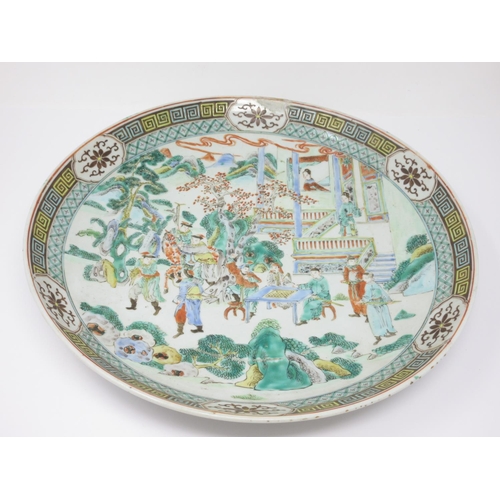 285 - A Chinese large Saucer Dish painted figures, etc, in famille verte enamels, 14in diam, small repair