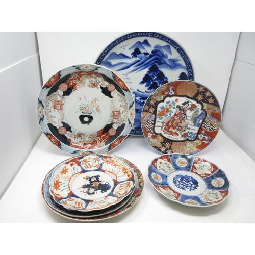 288 - A blue and white Charger painted mountainous landscape, 14 1/2 in, and six various Imari Plates, som... 