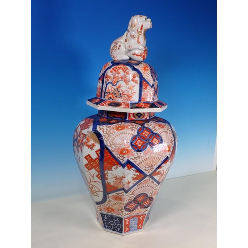 290A - A 19th Century Imari Jar and Cover, the domed cover with a Dog of Fo finial above an inverted balust... 