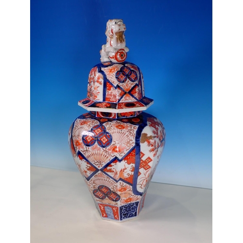 290A - A 19th Century Imari Jar and Cover, the domed cover with a Dog of Fo finial above an inverted balust... 