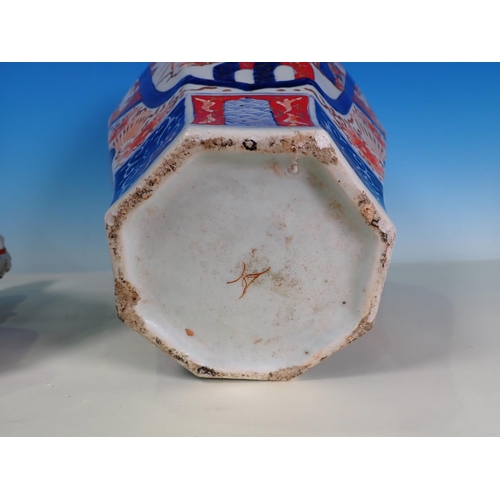 290A - A 19th Century Imari Jar and Cover, the domed cover with a Dog of Fo finial above an inverted balust... 