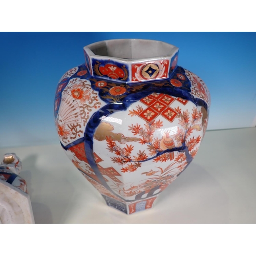 290A - A 19th Century Imari Jar and Cover, the domed cover with a Dog of Fo finial above an inverted balust... 