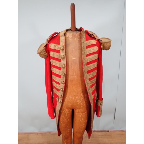 303 - A late 18th or early 19th Century British Army type 'Red Coat' with brass button initialled 'M', res... 