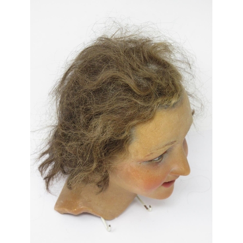 304 - An early 20th Century female wax mannequin Head with plaited brown hair and brown eyes