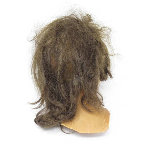 304 - An early 20th Century female wax mannequin Head with plaited brown hair and brown eyes