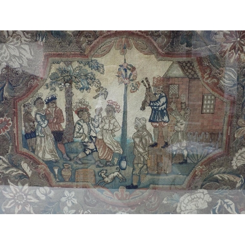 314 - An 18th Century Needlework Panel with shape reserve of figures dancing, floral surround, framed and ... 