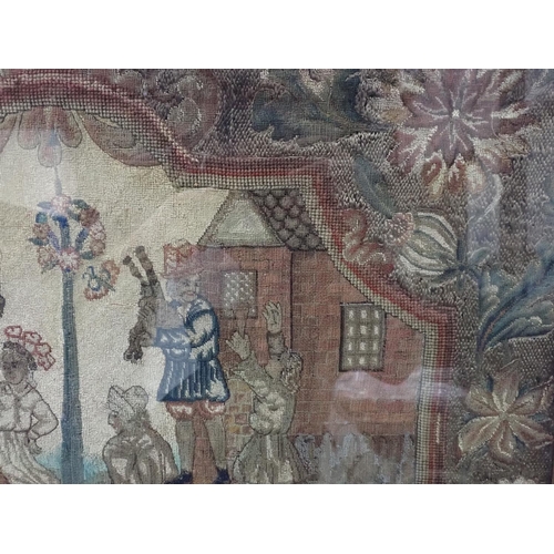 314 - An 18th Century Needlework Panel with shape reserve of figures dancing, floral surround, framed and ... 