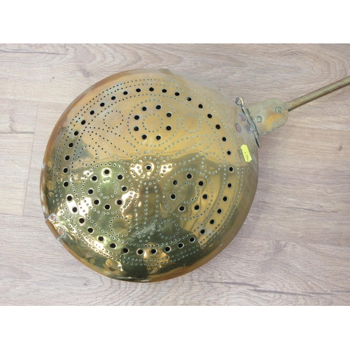 322 - An 18th Century brass Warming Pan with brass handle and pierced design to the cover, 3ft 9in L