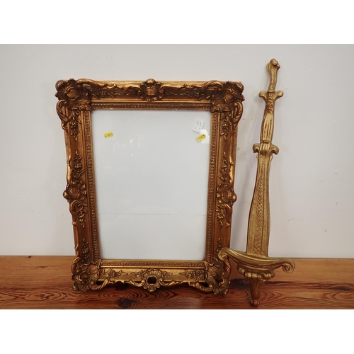 324 - A pair of gilt scroll Wall Brackets, a Plate Holder, a Picture Frame