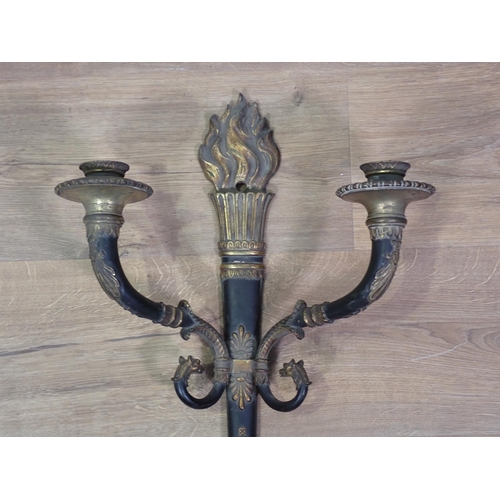 328 - A two branch Wall Light with flame finial, the scrolled arms with mythical head finials, 1ft 10in H