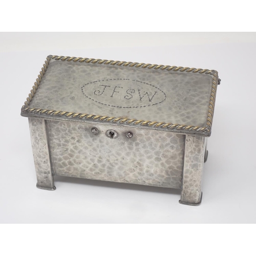 332 - A hammered pewter Arts and Crafts two division Tea Caddy in the form of a Black Mountain Coffer with... 