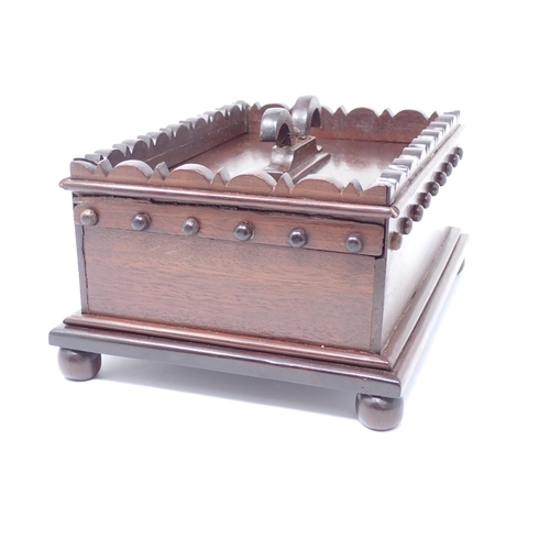 345 - A 19th Century mahogany Anglo-Indian Box with sliding lid and ram's horn handle mounted upon ball fe... 