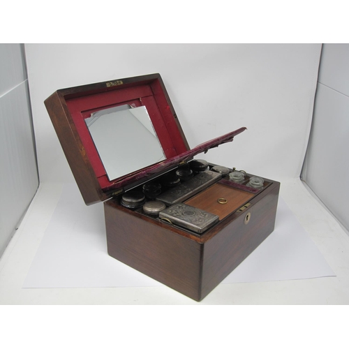 349 - A Victorian rosewood travelling Box with eleven silver plate bottles and boxes, the front section wi... 