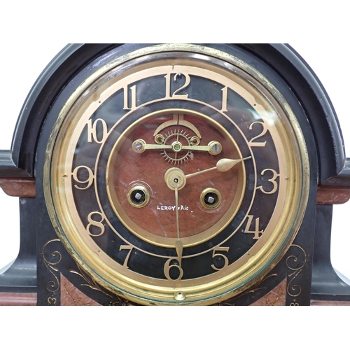 365 - A black marble Mantel Clock/Barometer, the circular clock dial with exposed movement, above a circul... 