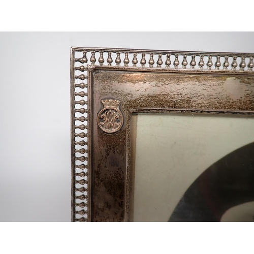 38 - A Geo V silver Photograph frame with pierced gallery edge, containing a signed photograph of Prince ... 