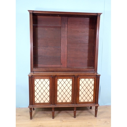 386 - A Regency mahogany open Bookcase with adjustable shelves upon base fitted three brass lattice and li... 