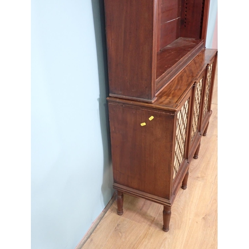 386 - A Regency mahogany open Bookcase with adjustable shelves upon base fitted three brass lattice and li... 