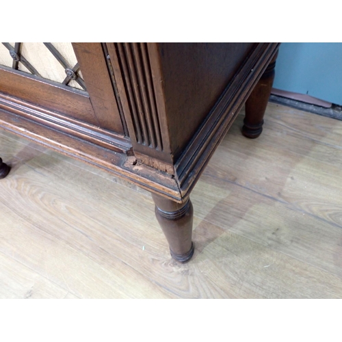 386 - A Regency mahogany open Bookcase with adjustable shelves upon base fitted three brass lattice and li... 