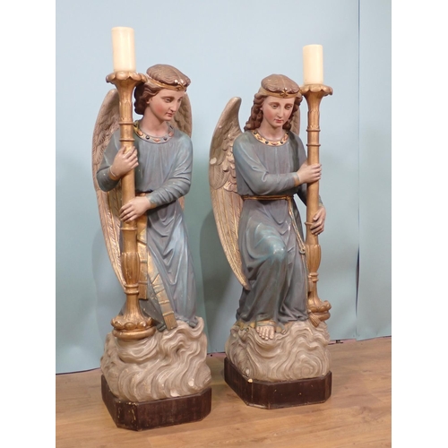 396 - A pair of 19th Century painted plaster standing Candle Stands in the form of angels, painted letteri... 