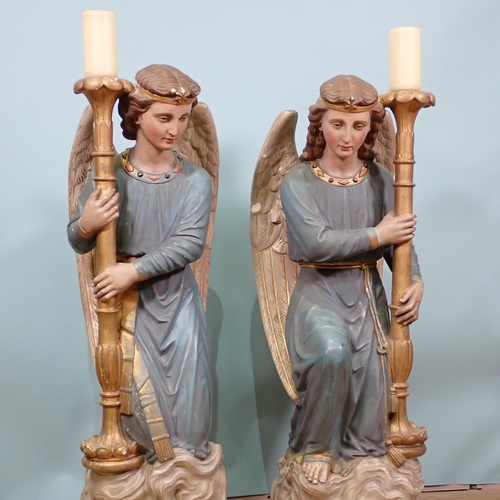 396 - A pair of 19th Century painted plaster standing Candle Stands in the form of angels, painted letteri... 