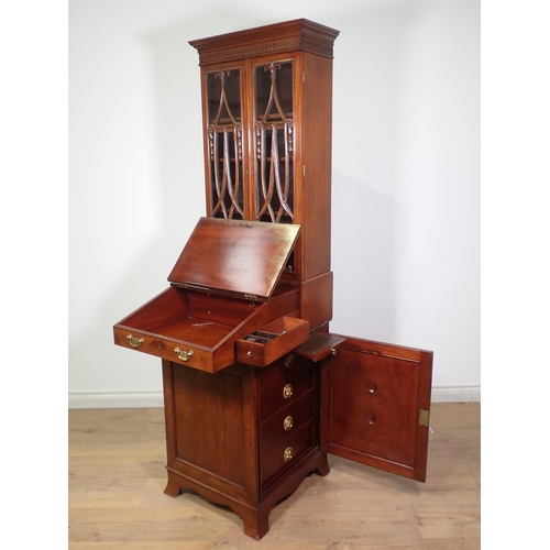 398 - A Victorian mahogany Davenport Bookcase of elegant proportions, the upper section fitted pair of swa... 