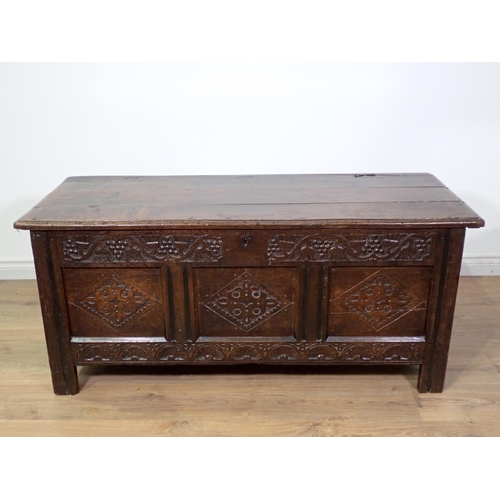 400 - A 17th Century oak three panel Coffer with moulded lid above grape and thistle frieze and diamond ca... 