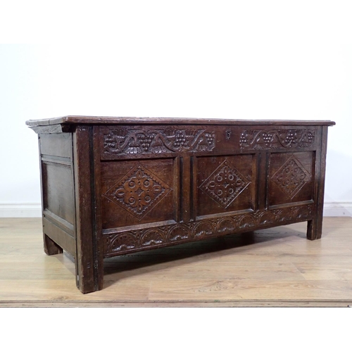 400 - A 17th Century oak three panel Coffer with moulded lid above grape and thistle frieze and diamond ca... 