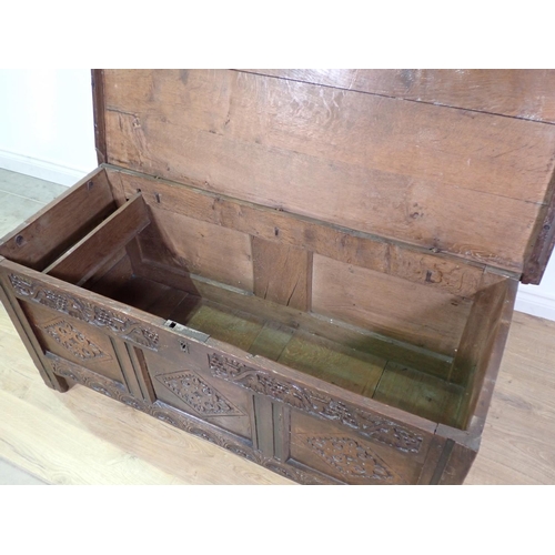 400 - A 17th Century oak three panel Coffer with moulded lid above grape and thistle frieze and diamond ca... 