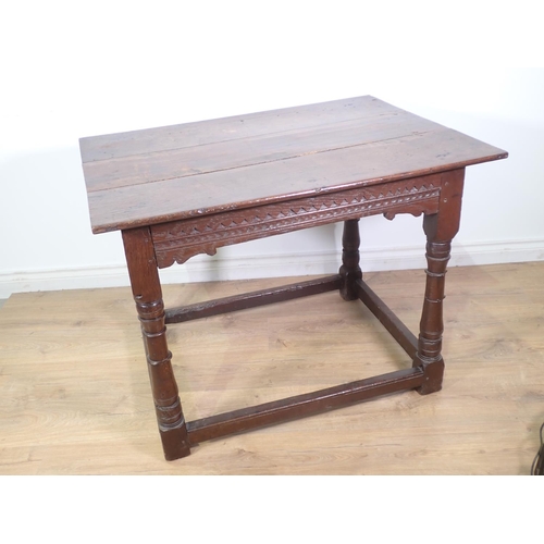 403 - A mid-17th Century oak Altar Table with three plank top above chip and zig zag carved frieze mounted... 