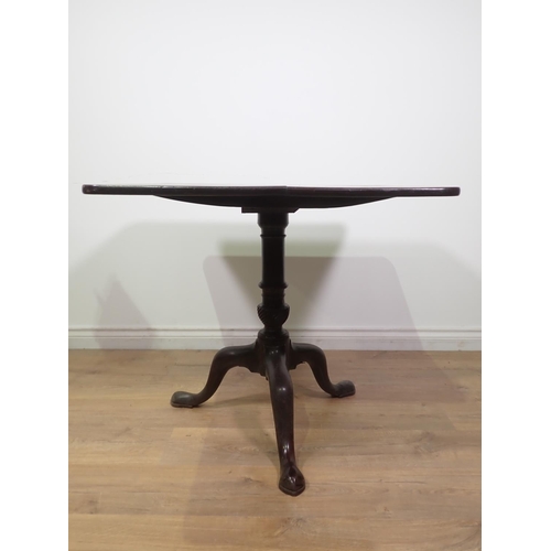 405 - A George III mahogany rectangular Supper Table on barrel turned column and tripod support with pad f... 