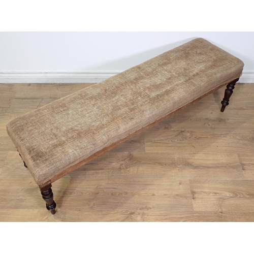 422 - A Victorian mahogany Footstool on turned supports in need of re-upholstery 4ft 4in W x 1ft 4in H