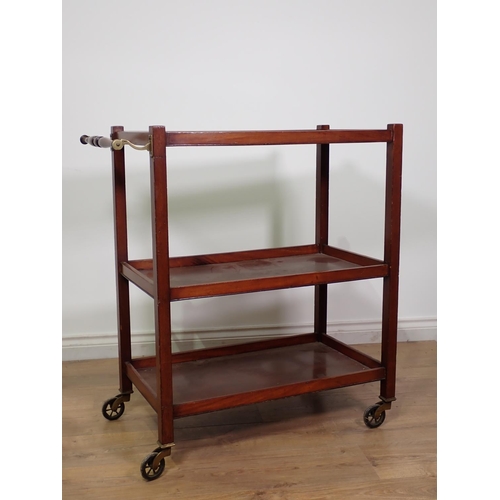 423 - An Edwardian mahogany three-tier Book Trolley on spoked casters 2ft 11in H x 2ft 8in W